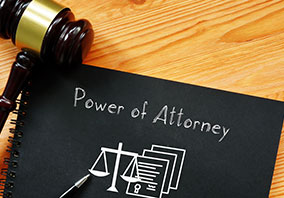 Power of Attorney document with scales of justice and gavel for legal planning.